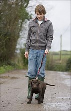 Boy with Labrador Retriever