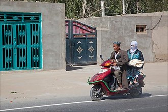 Uyghur man in traditional Muslim dress