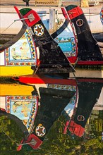 Colourful hand-painted stern of a gondola like Moliceiro