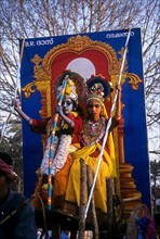 Drama artists in a festival procession dressed like Lord Krishna with His consort Radha in Thrissur Trichur
