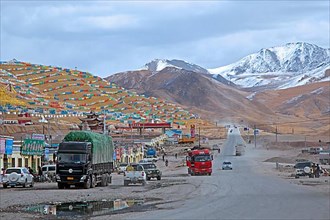 Tibetan prayer flags in a settlement along a high road through the Himalayas between Xining and Yushu