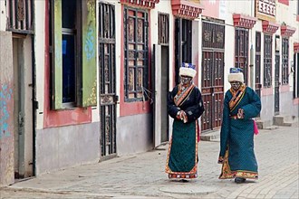Two Tibetan woman in traditional dress in Maduo. Madoi County in the southeast-central province of Qinghai
