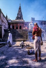 The image of a man praying to ancestors Pinddaan at Vishnupad Gaya