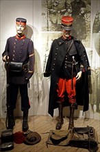 Uniforms of a Belgian soldier and a French officer from the First World War in the Memorial Museum Passchendaele 1917 in Zonnebeke