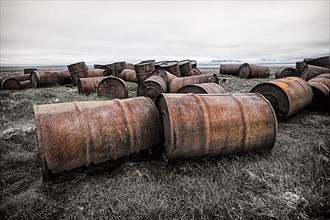 Rusted barrels in the tundra