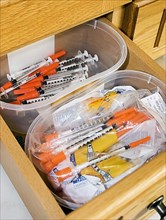 Drawer with insulin syringes for diabetic domestic cats