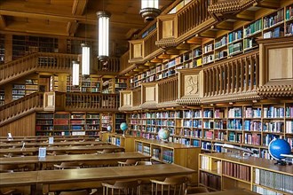Interior with large bookshelves with book collections in the University Library of Leuven