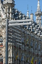 Signpost in front of the Gothic Town Hall at the Grote Markt
