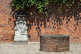 Fountain and water pump in the Grand Beguinage