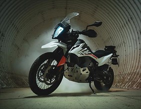 Gloomy shot of a motorbike in a round tunnel with fog
