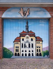 Graffito with Lueneburg town hall on a garage door
