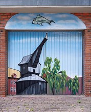 Graffito with Lueneburg historical crane on a garage door
