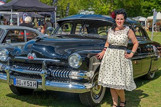 American vintage Ford Mercury with a woman