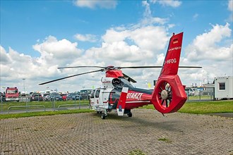 Rescue helicopter type Airbus Helicopters AS365 Dauphin on landing field for helicopters
