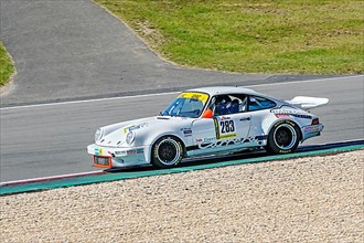 Historic racing car Porsche 911 RS at car racing for classic cars youngtimer classic cars 24-hour race 24h race