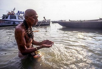 A pilgrim pays homage to the mother of Rivers Ganges at Varanasi