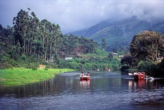 Boating on the lake in Munnar hill resort situated at the confluence of three rivers