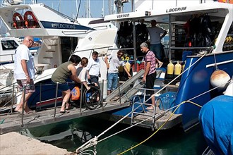 Disabled divers on board diving ship