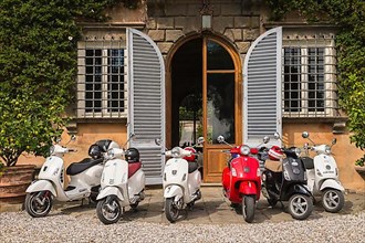 Italian Vespa scooters in front of Tenuta di Valgiano