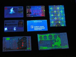 Fluorescent banknotes and identity cards