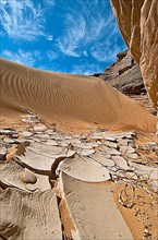 Dunes and rock formation in sand desert