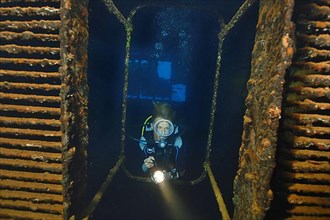 Diver penetrates engine room