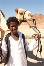 Young Bedouin with dromedary