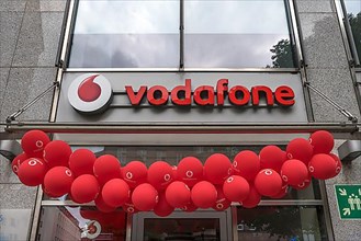 Red balloons at a Vodafone branch