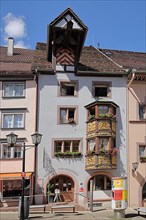 Tourist information house with ornate bay window and crane dormer in Rottweil