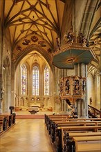 Interior view with pulpit of the late Gothic Heilig Kreuz Minster