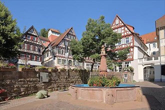Ornamental fountain at the market place with half-timbered houses in Calw