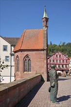 St. Nicholas Chapel built in 1400 and statue by Hermann Hesse on St. Nicholas Bridge in Calw