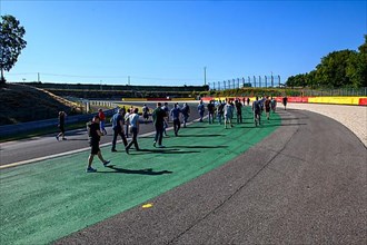 Participants of Trackday at track inspection of turn at race track for motorsport car racing of Participants of Trackday