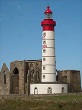 The lighthouse Phare de Saint-Mathieu with the chapel Notre Dame de Grace of Our Lady of Grace in the department of Finistere at the western tip of Brittany