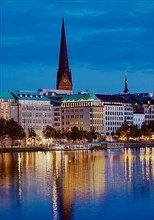 Inner Alster Lake with the main church St. Petri in the evening
