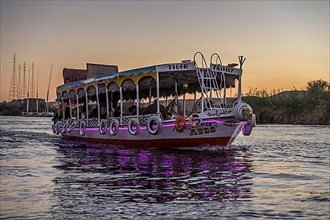 Illuminated excursion boat on the Nile near Aswan