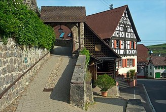 Gate at Hinterer Kirchweg to the parish church of Saint Petronilla and half-timbered house Dutters Stube