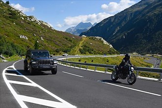 Gotthard Pass Motorcyclist overtakes passenger car