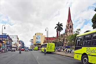 Green People's Buses and Church La Iglesia de Nuestra Senora de La Merced