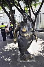 Whimsical sculpture of an overweight woman in Avenida-Central