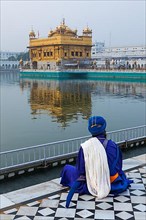 Unidentifiable Seekh Nihang warrior meditating at Sikh temple Harmandir Sahib. Amritsar