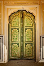 Wooden old ornamented door vintage texture background