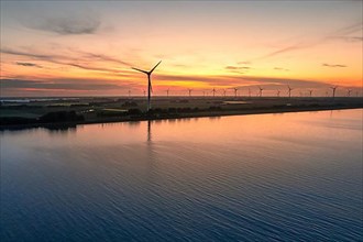 Aerial view of a wind farm at sunset