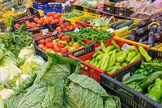 Market stall with various vegetables such as savoy cabbage