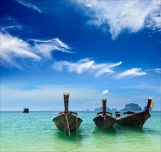 Long tail boats on tropical beach