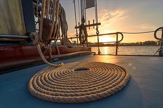 Rope snail on historic sailing ship at sunset. Ijsselmeer