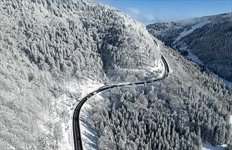 Aerial view of a road through white winter landscape