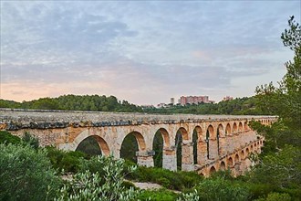 Old roman aqueduct at sunrise