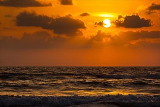 Ocean sunset concept background. Baga beach. Goa