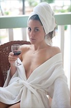Young woman in bathrobe
